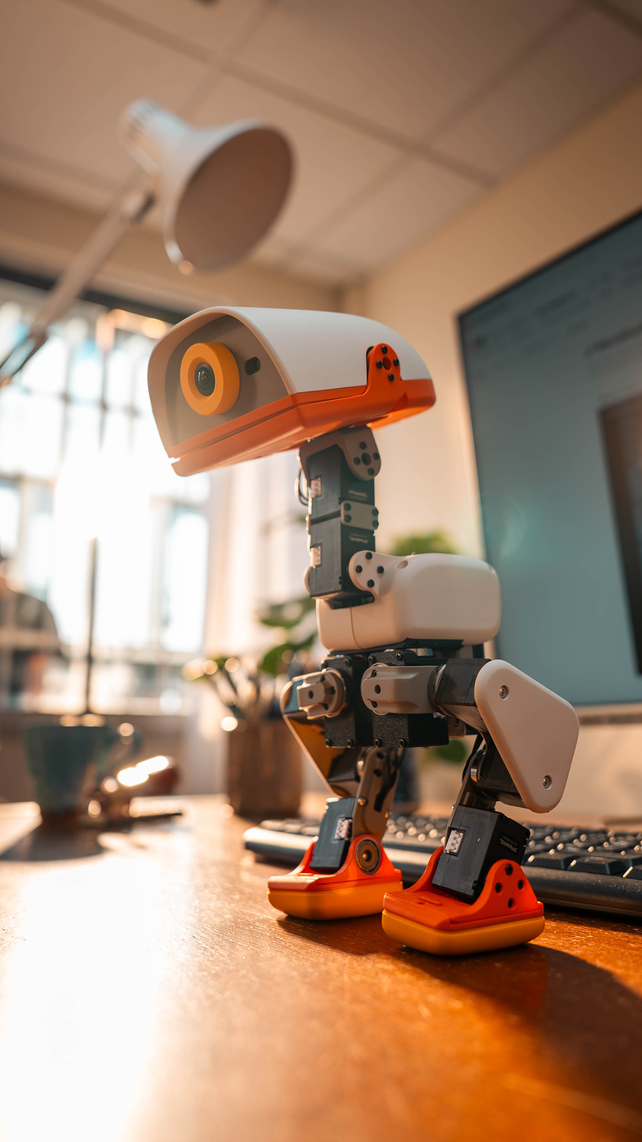 Close-up of the Microduck on a desk in warm lighting (official launch photography).